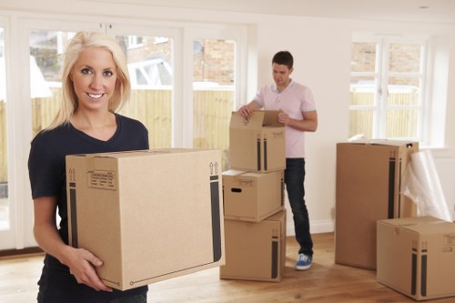 Professional home move planning in Italy with packed boxes and moving truck