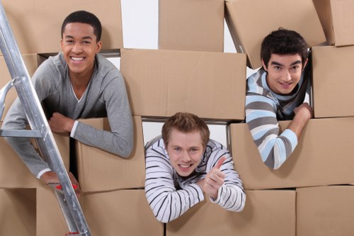 Relocation specialists organizing office setup in a new Italian workspace