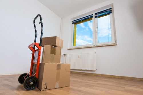 Furniture removal team handling sofas and cabinets in an Italian apartment