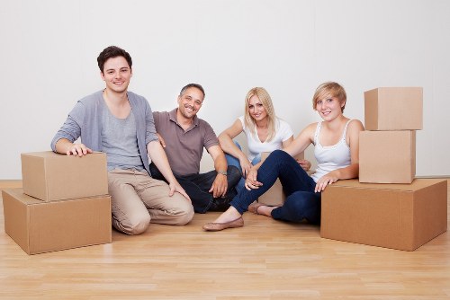 Movers handling furniture during a home relocation in Italy